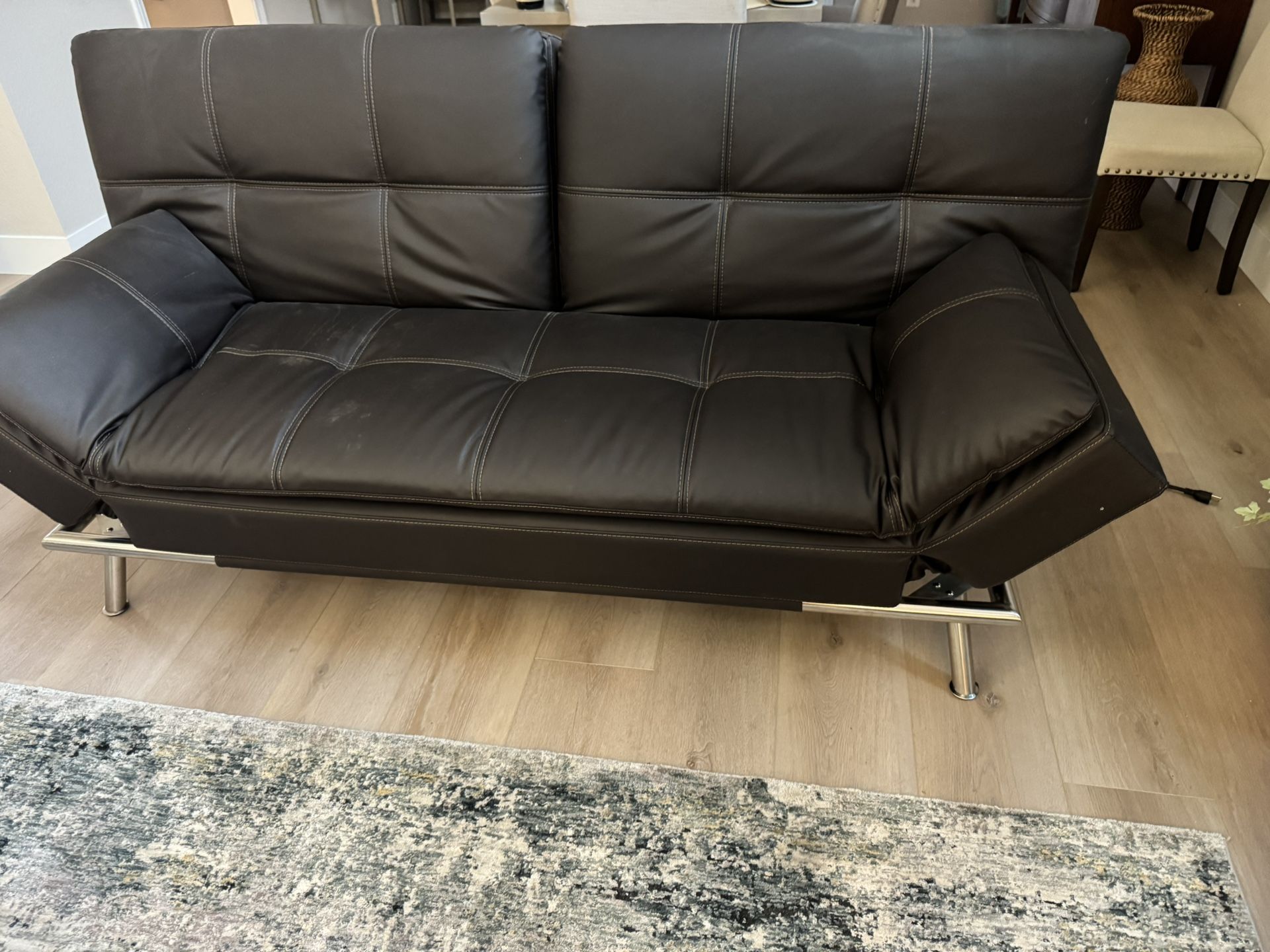Full size sleeper sofa bed futon. Looks brand new @75” x38” electronics.Sells now 749 Costco see pic