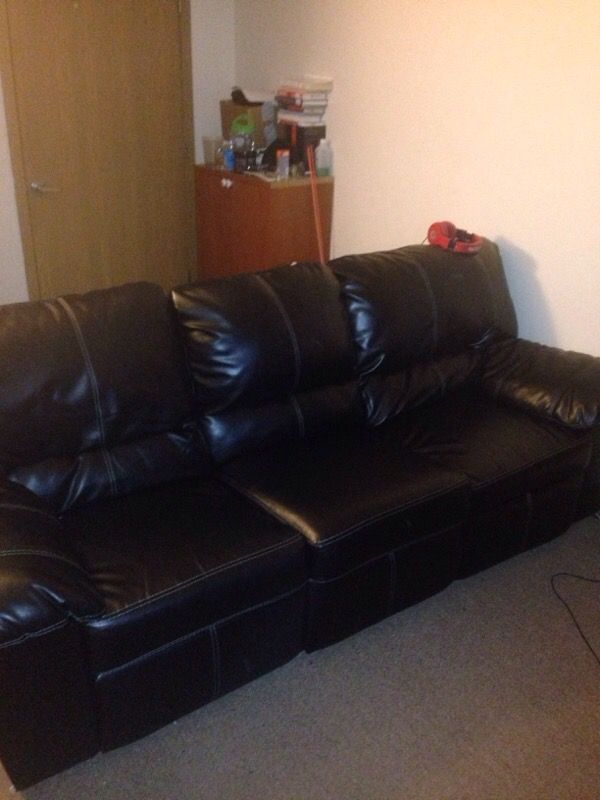 Black leather couch with recliners