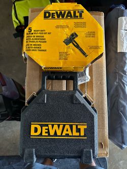 New DeWalt 5 heavy-duty self-feed bit set. Comes in black case. Has 5 self-feed bits and extension. Bits are 1-1/2 inch, 2-1/16 inch, 2-3/16 inch, 2-1