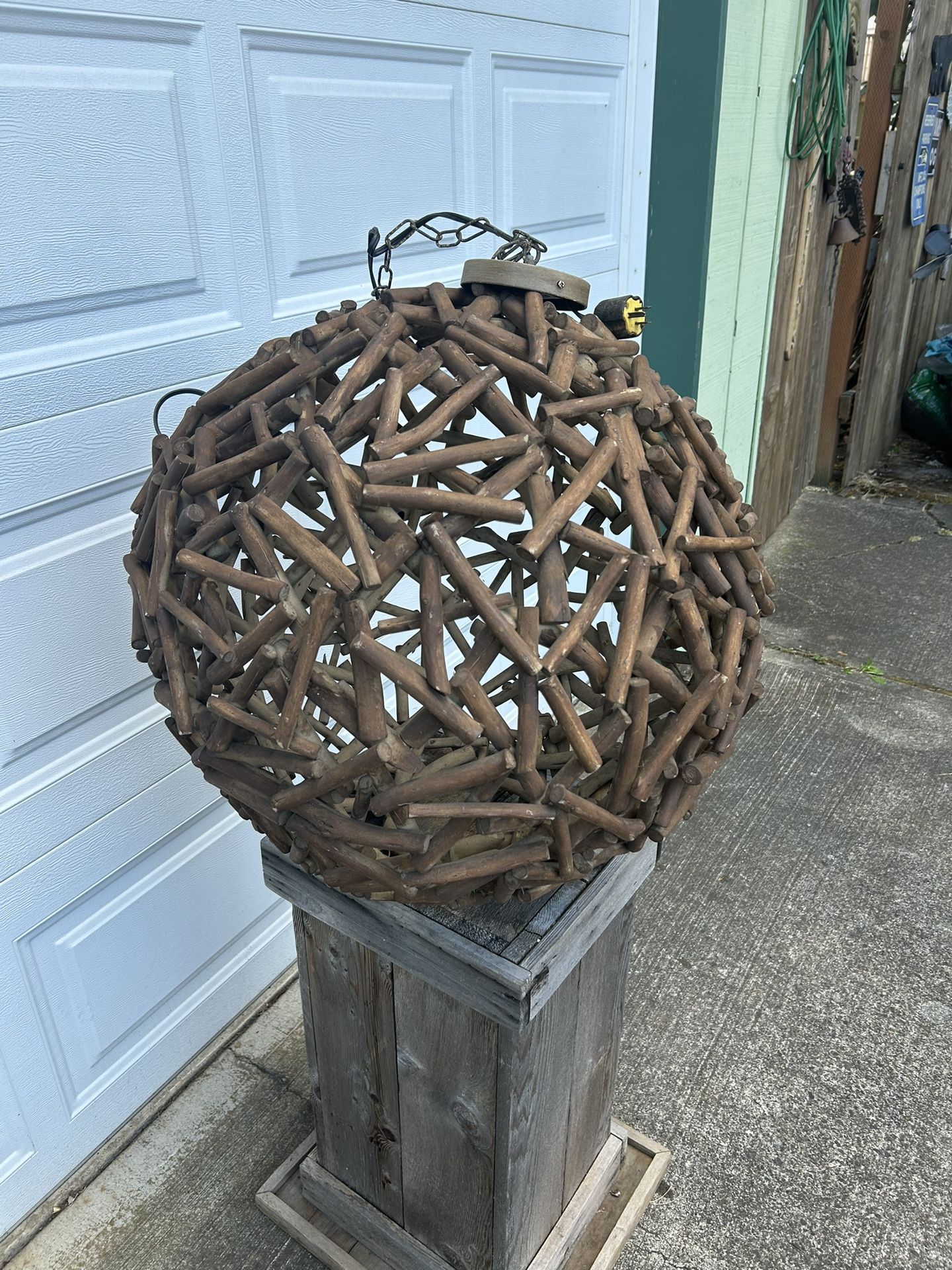 Beautiful wooden mid-century modern looking light fixture approximately ball shaped and approximately 2 feet across and in good shape. Has plug but c