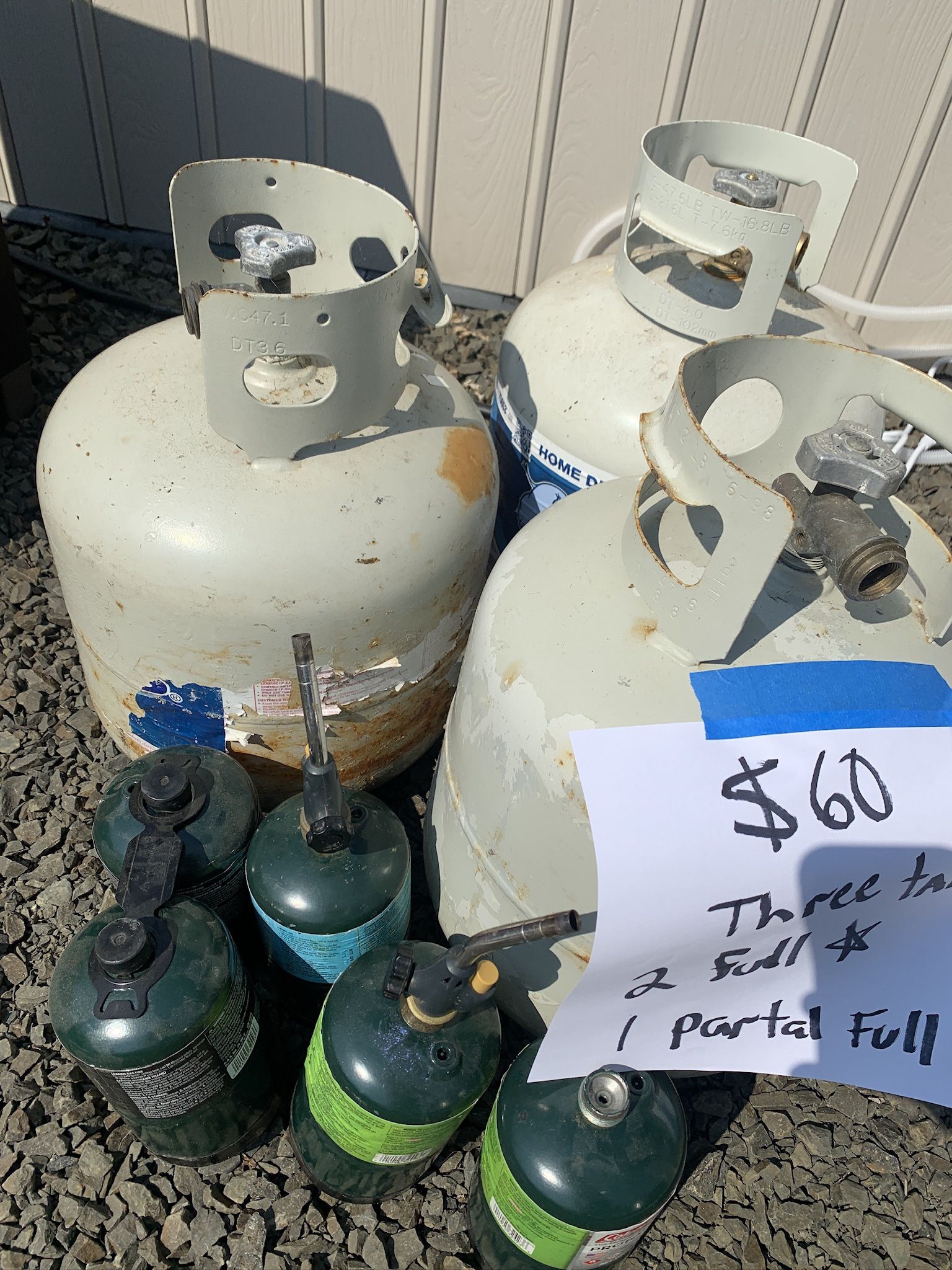 Propane tanks 2 full 1 partial plus small tanks