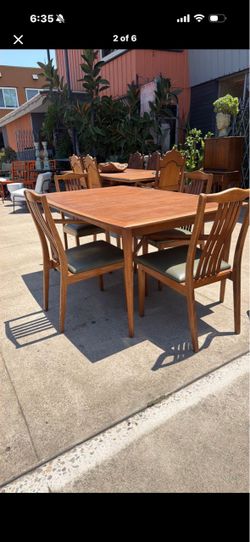 Mid Century solid, walnut dining table with four chairs