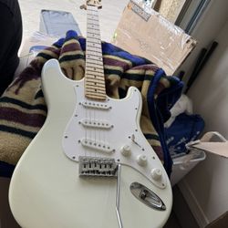 Red and white electronic guitar