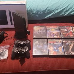 Playstation 2 Slim original box, plus accessories and PS2 Games