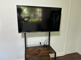 43” Hisense TV + Stand w/ Wheels – Ready Setup