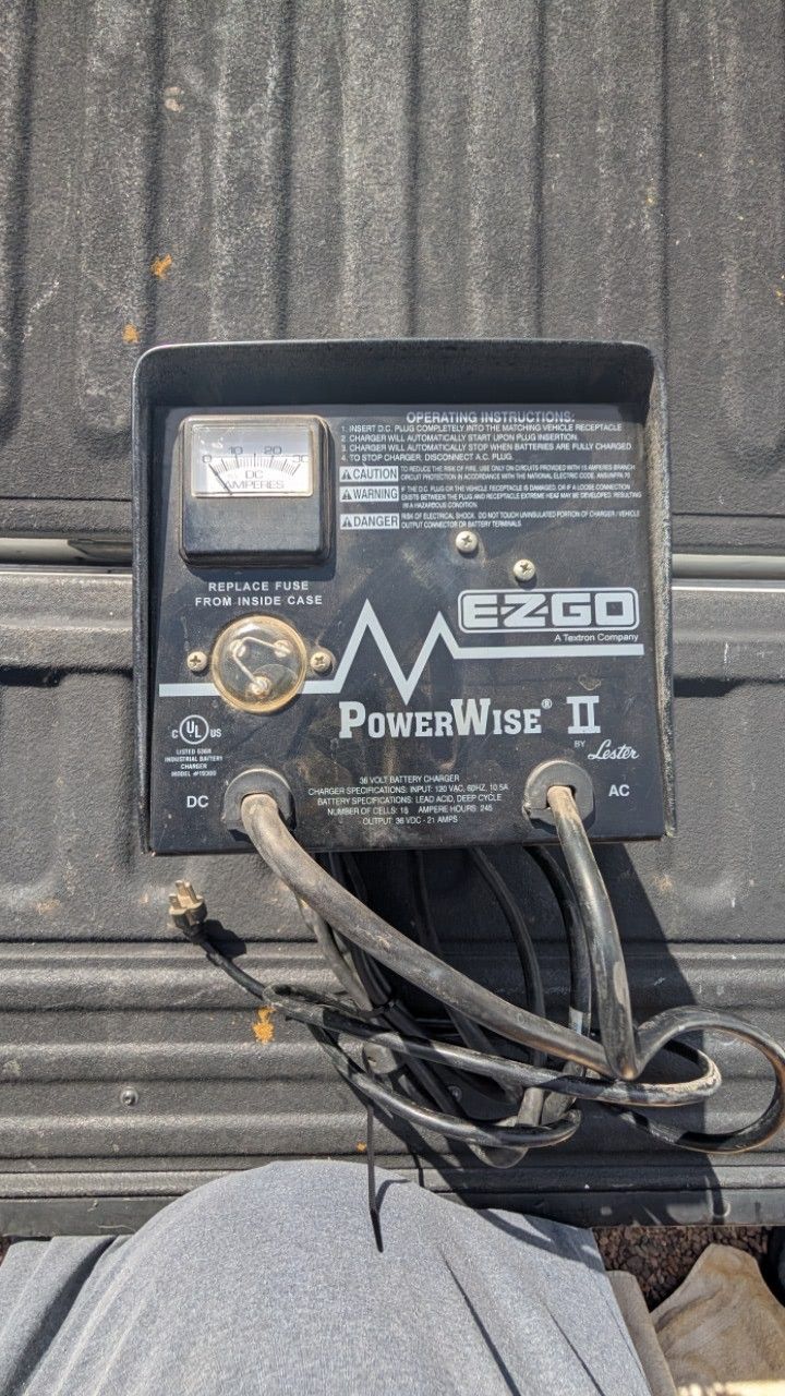 Power wise 36volt charer, DC ammeter gauge and a fuse replacement notice. The charger is labeled '36 Volt Battery Charger' 