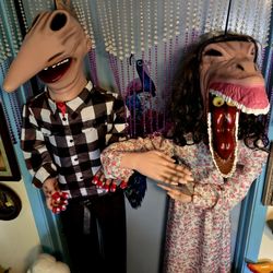 life-sized hanging Halloween decorations of the characters Adam and Barbara Maitland from the movie Beetlejuice, produced by Spirit Halloween. 