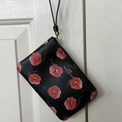 Coach Wristlet with flowers in like new condition. 
