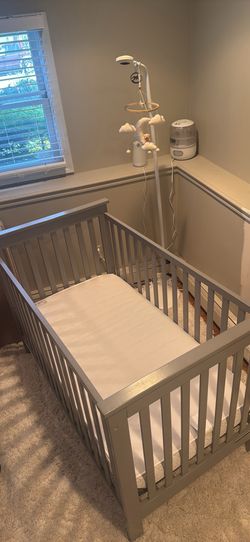 Delta Children grey crib along with sealy mattress