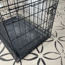 2 Dog Cages One With Tray Other Without 