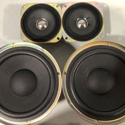 a set of four speakers