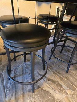 Modern high-top dining table with 4 swivel stools
