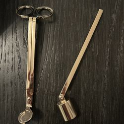 Candle accessories; gold toned wick trimmer and candle snuffer. New but out of package. 
