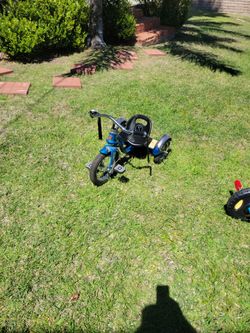 Blue Schwinn tricycle