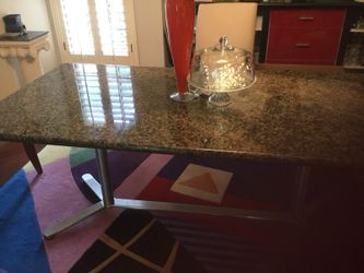 Solid Granite Dining Room table. Has silver conference style base. Very beautiful and extremely Heavy. Cash and Carry Sale Price! Bring truck and lo