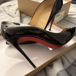 Christian Louboutin black pattern, leather pumps