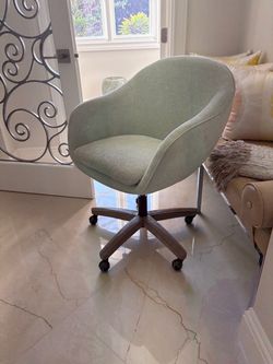 Light teal green swivel chair