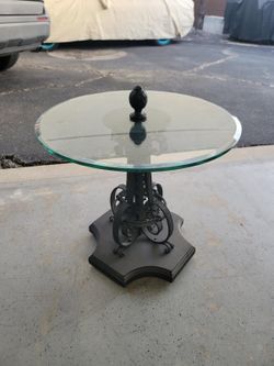 Elegant Round Glass Accent Table with Decorative Metal Base