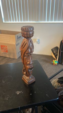 This item is a vintage hand-carved wooden tribal bust,