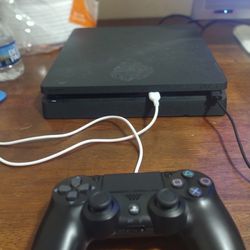 Ps4 Slim and a controller and Gta5 and Nba2k24 and 27 In Tv