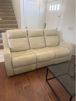 Beige leather reclining sofa