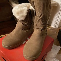 By Guess brown fur boot that is similar to UGGs