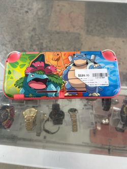 Nintendo Switch Lite Coral Handheld with Pokémon Artwork