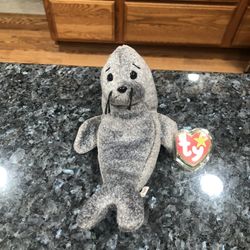 Ty Beanie Babie “Slippery” Baby Seal.  1998.  Size  7 inches tall.  Sits  up.  Brand New with Tags.  