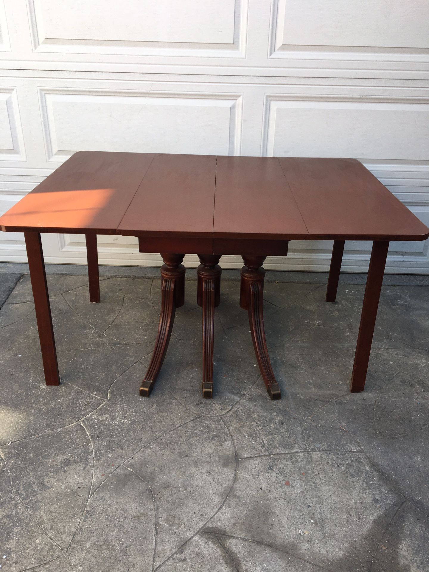 Antique foldable dining table with two extension leafy