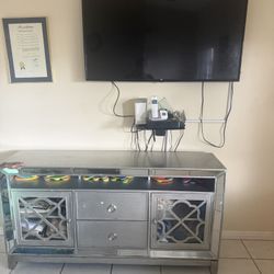 TV stand with TV. 
