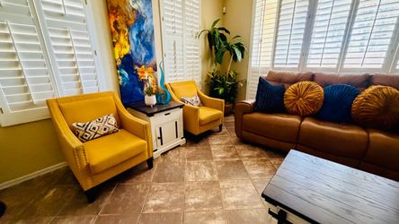Beautiful Carocc accent chairs witnailheads and solid wood yellow lines