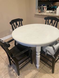 OBO white table and 6 black chairs
