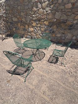 Gorgeous antique patio set, heavy weight, 4 rocking chairs plus 1 table, good condition, $700 FIRM!