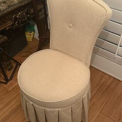 Beige Upholstered Accent Chair with Skirted Base