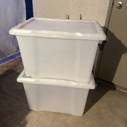 2 plastic/tote tubs with lids
