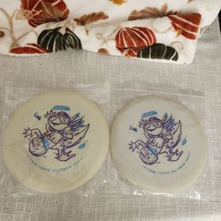 Pair of simon lizotte halloween 2023 glow disc gold discs