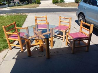Wooden log table with glass top with 4 chairs