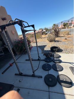 Squat rack, weight plates and Olympic barbells