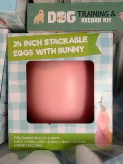 This "Stackable Eggs With Bunny" decoration stands 24 inches tall and features two pink eggs topped with a bunny.