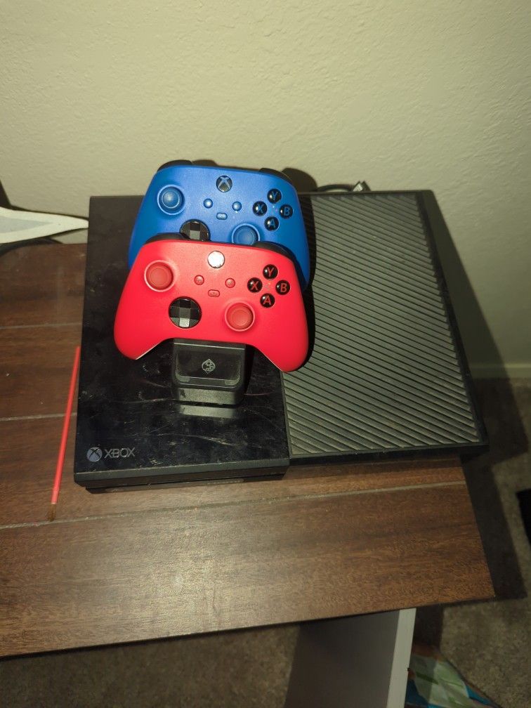 Xbox One And 360 With Games And Controllers