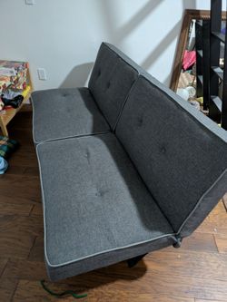 Gray futon, convertible sleeper , very comfy