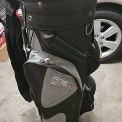 Golf bag with clubs and golf balls