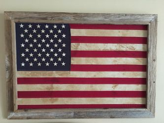 Vintage American flag in wood .