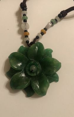 Natural emerald green color carved jade flower shaped pendant