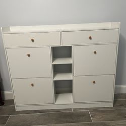 new wooden closet for shoes and other things with several compartments