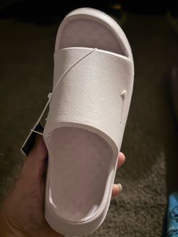 Pearl pink Nike slides