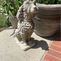 To concrete dog statues