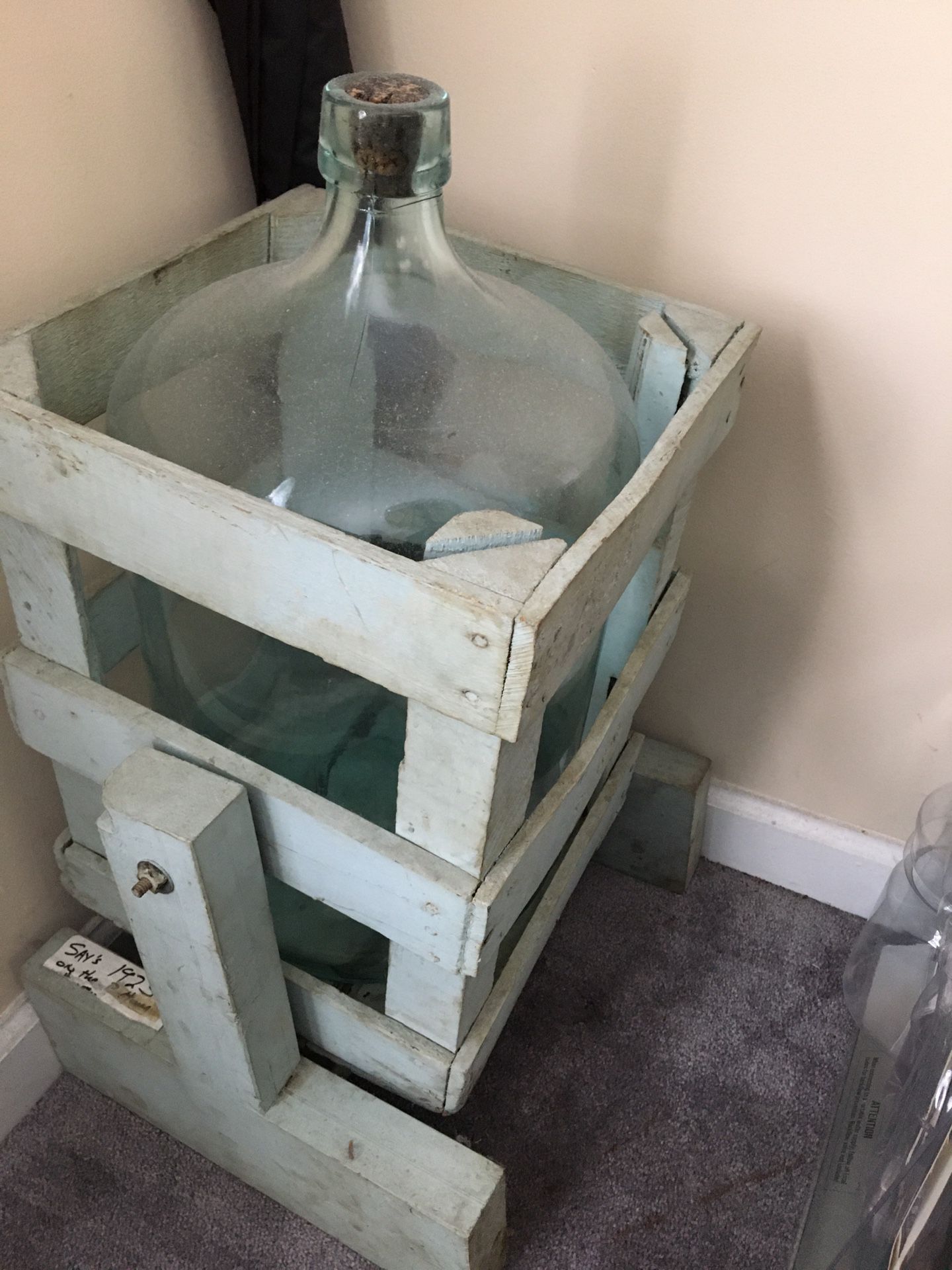Vintage water bottle in tilt stand from 1923