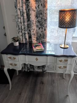Refinished Beautiful French Provincial Desk/Vanity . White with a navy blue top in perfect condition6s. This is a rare find as you can see in the pict