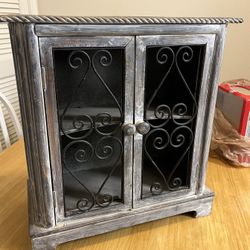Small Grey Wooden Cabinet With Metal Doors 